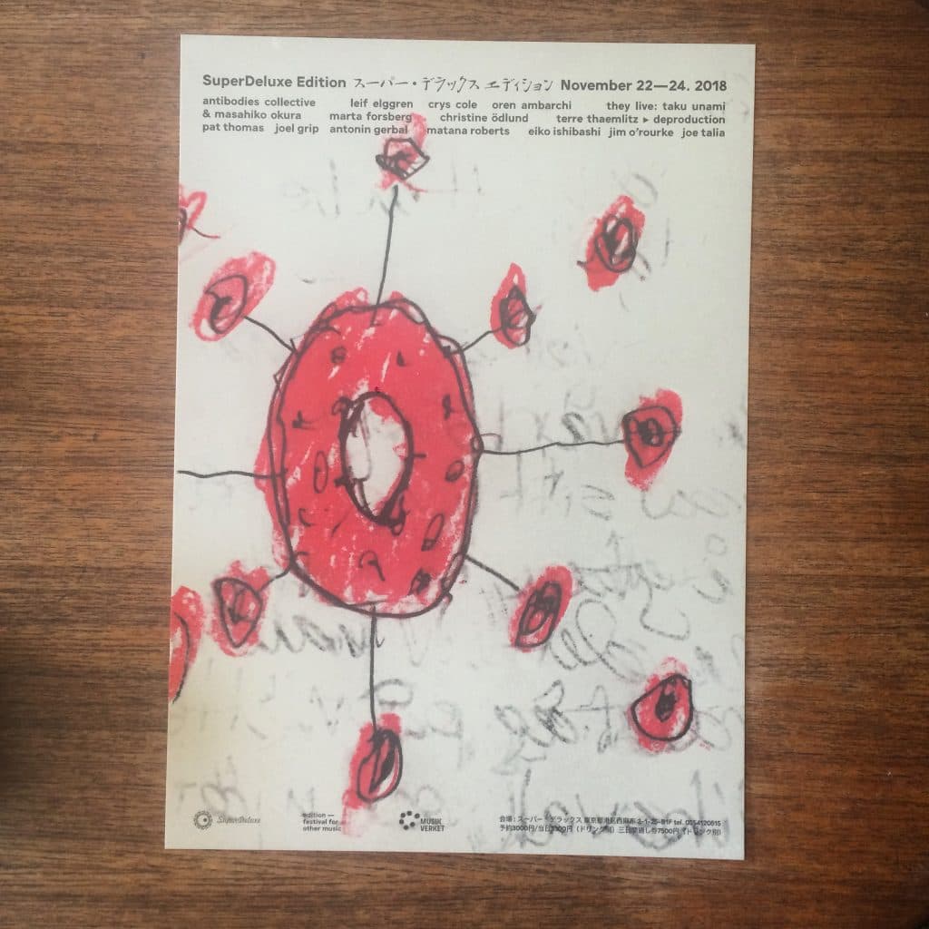A flyer with a red abstract drawing in the center, surrounded by text listing names and event details for "SuperDeluxe Edition" from November 22–24, 2018.